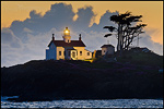 Picture: Storm clouds at sunset behind Battery Point Lighthouse, Crescent City, California