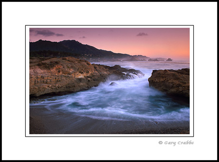 Ocean waves spill into coastal cove at Point Lobos State Reserve, near Carmel, Monterey County Coast, California