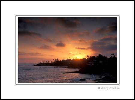 Sunset and coastal fog over cove at Laguna Beach, Orange County Coast, California