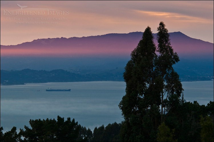 Photo: Beam of red sunlight and Mount Tamalpais at sunset over San Francisco Bay, from the Berkeley Hills, California