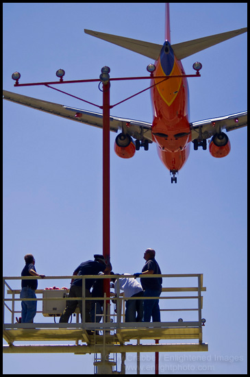 Picture: Work crew replacing runway approach lights, Los Angeles Int'l. Airport, California