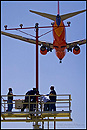 Picture: Work crew replacing runway approach lights, Los Angeles Int'l. Airport, California