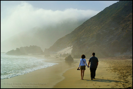 Picture: Couple walking on sandy beach, Big Sur Coast, California