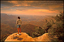 Picture: Female tourist overlooking the Grand Canyon at sunset, Grand Canyon National Park, Arizona