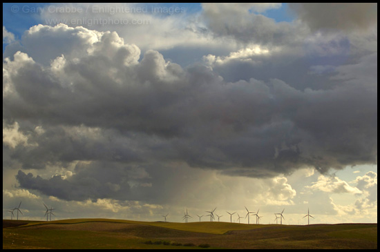 Picture: Storm clouds over wind turbines in wind farm at Solano County, California