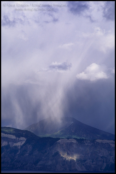 Photo: Sunlit rain storm cloud raining over Mount Scott, Crater Lake National Park, Oregon