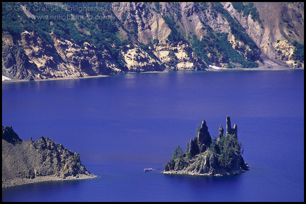 Photo: Tourist boat cruising around the Phantom Ship, Crater Lake National Park, Oregon