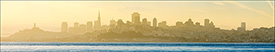 Picture: San Francisco city skyline at sunrise rising above San Francicso Bay, California