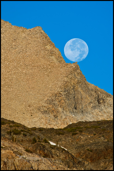 Picture Full moon setting over a rock outcrop near Tioga Pass, Yosemite National Park, California