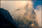 Picture: Storm clouds at sunset shroud the sheer cliff walls of Sentinel Rock, Yosemite Valley, Yosemite National Park, California