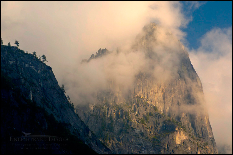 Picture: Storm clouds at sunset shroud the sheer cliff walls of Sentinel Rock, Yosemite Valley, Yosemite National Park, California