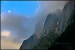 Picture: Moonrise and clouds at sunset next to Glacier Point, above Yosemite Valley, Yosemite National Park, California