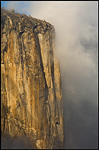 Picture: Storm clouds shroud the sheer granite walls of El Capitan at sunset Yosemite Valley, Yosemite National Park, California