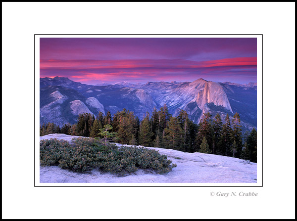 Picture: Alpenglow on clouds at sunset over Half Dome, Yosemite National Park, California