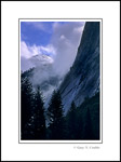Picture: Winter clouds part over the granite apron below Glacier Point, Yosemite Valley, Yosemite National Park, California