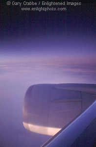 First light at 35,000 feet; sunrise over cloud covered Atlantic Ocean enroute to Paris