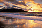 Sunset and fog over Lands End from Baker Beach, San Francisco, California