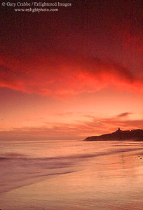 Red-sky sunset over beach at Natural Bridges State Park, Santa Cruz, California