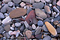 Smooth rocks and pebbles on shoreline beach, Montana del Oro State Park, Central Coast, California