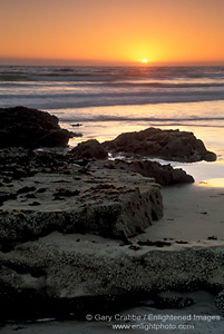 Sunset over the Pacific Ocean and coastal rocks, Morro Strand State Beach, Central Coast, California; Stock Photo photography picture image photograph fine art decor print wall mural gallery