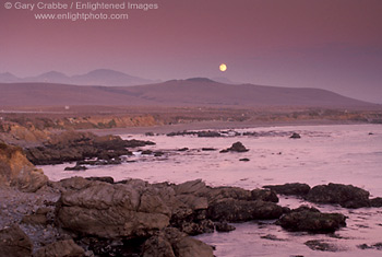 Full moon rising in purple evening sky over coastal hills, near San Simeon, Central Coast, California; Stock Photo photography picture image photograph fine art decor print wall mural gallery