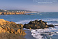 Coastal fog, blue water, and rocky shoreline at Cambria, Central Coast, California