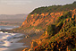 Golden sunset light on coastal cliffs and beach, Leffingwell Landing, Cambria, Central Coast, California