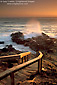 Stairs leading down to rocky shoreline and ocean waves at sunset, Leffingwell Landing, Cambria, Central Coast, California