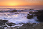 Waves crash on coastal rocks at sunset, Point Lobos State Reserve, near Carmel, California