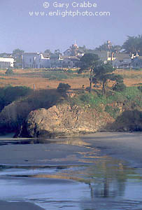 Reflections on beach below the small coastal town of Mendocino, California