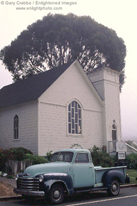 Old pick-up truck in front of the Greenwood Church, Mendocino Coast