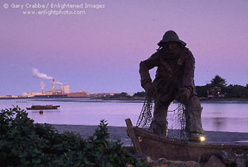 Statue of fisherman at dawn on Humboldt Bay, Eureka, California