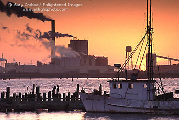 Fishing boat and pulp mill at sunset, in Humboldt Bay, Eureka, Humboldt County, California