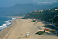 Santa Monica Mountains over sand shoreline at Point Dume State Beach, near Malibu, Los Angeles County Coast, Southern California
