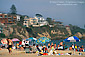 Crowded sand beach and sunbathers and umbrella, Corona del Mar, Newport Beach, California