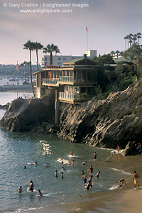 Coastal home over crowded sand beach, Corona del Mar, Newport Beach, California