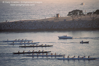 Crew boat skulls racing in calm sea water harbor channel, Newport Beach, Orange County, California