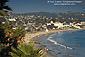 Overlooking waterfront town and sandy coast shore at Laguna Beach, California