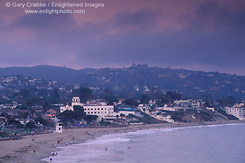 Overlooking waterfront town and sandy coast shore in evening light at Laguna Beach, California