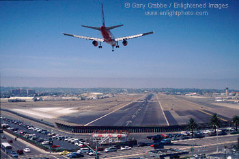 Airliner Jet Airplane on approach for landing on runway at Lindbergh Field, San Diego Int'l Airport, San Diego, California