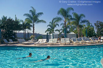 Couple swimming in pool at Four Season's Aviara Hotel and Resort, Carlsbad, San Diego County, California