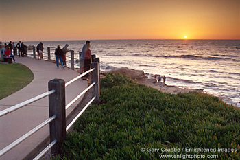 Tourists watching the sunset over the Pacific Ocean from Scripps Park, La Jolla, San Diego County Coast, California