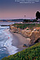 Evening light over ocean waves and sand beach at Scripps Park, La Jolla, San Diego County Coast, California