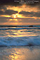 Sunset light and fog over ocean waves breaking at Torrey Pines State Beach, near Del Mar, San Diego County Coast, California