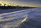 Ocean wave cresting toward beach at Oceanside, San Dieg County Coast, California