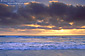 Sunset and fog over breaking waves in the Pacific Ocean, Torrey Pines State Beach, near La Jolla, San Diego County Coast, California