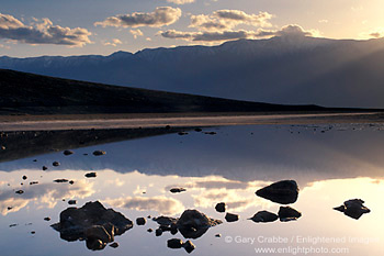 Sunset over the Panamint mountains reflected in water, Badwater, Death Valley National Park, California; Stock Photo image picture photo Phograph art decor print wall mural gallery
