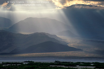 Clouds and Crepuscular Rays Sunbeams on Alluvial fan and hills at sunset, Death Valley National Park, California; Stock Photo image picture photo Phograph art decor print wall mural gallery