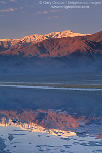 Mountains reflected at sunrise in flooded waters of desert basin, Death Valley National Park, California; Stock Photo image picture photo Phograph art decor print wall mural gallery