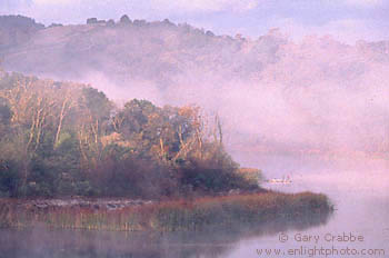 Fishermen on dock as mist and fog rise at sunrise, Lafayette Reservoir, Contra Costa County, San Francisco Bay Area, California